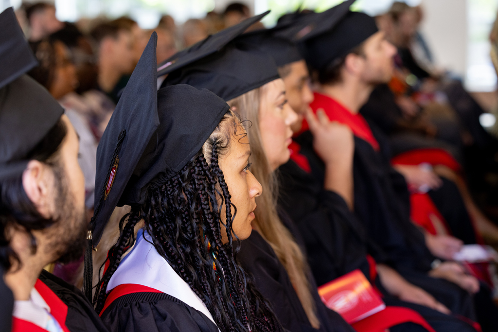 Pharmacy_Graduation_2024_036 Graduates listen to speakers