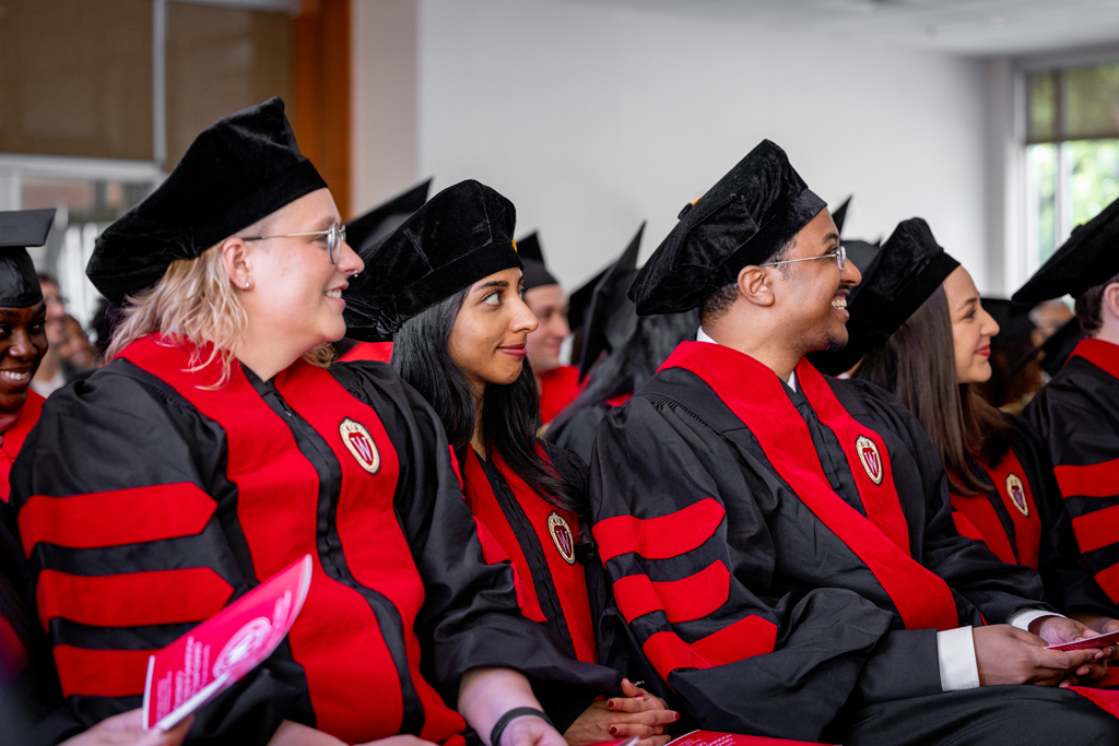 Pharmacy_Graduation_2024_038 Graduates listen to speakers