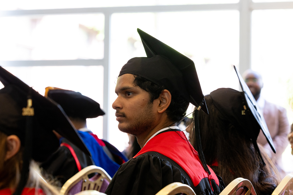 Pharmacy_Graduation_2024_050 Graduates listen to speakers