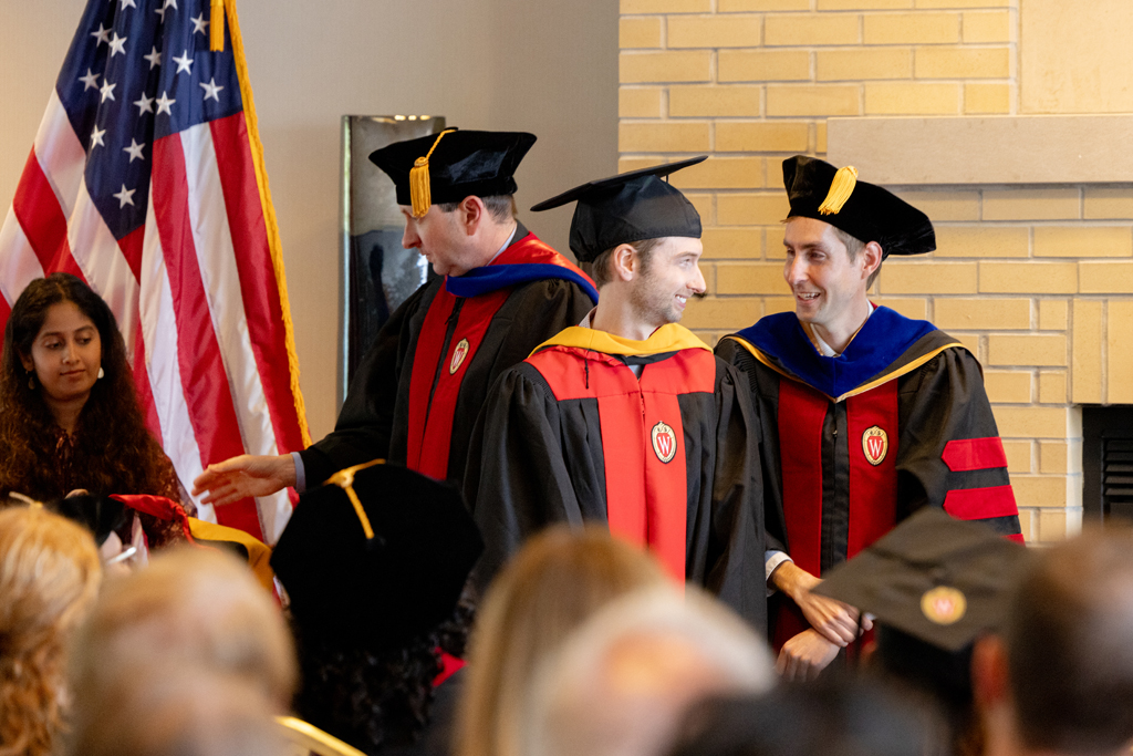 Pharmacy_Graduation_2024_062 A graduate receives his hood