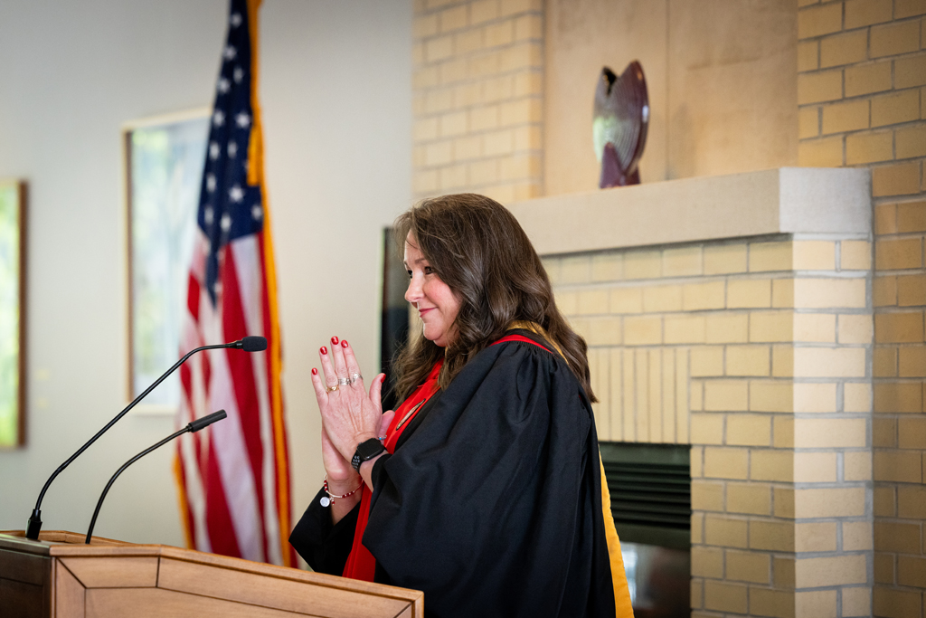 Pharmacy_Graduation_2024_073 Lindy Stoll speaks at the podium