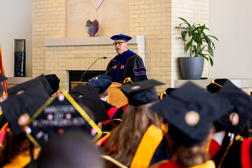 Pharmacy_Graduation_2024_075 Arash Bashirullah speaks at the podium