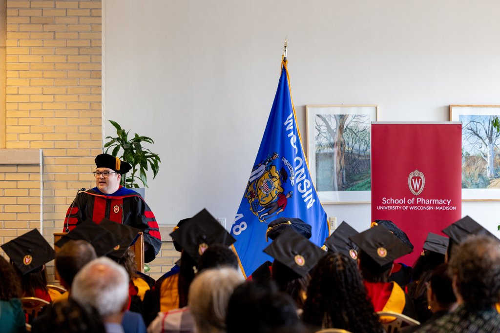 Pharmacy_Graduation_2024_101 Jason Chladek speaks at the podium
