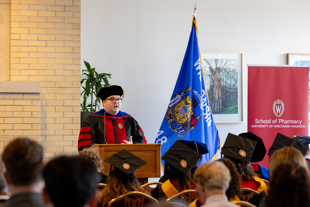 Pharmacy_Graduation_2024_102 Jason Chladek speaks at the podium