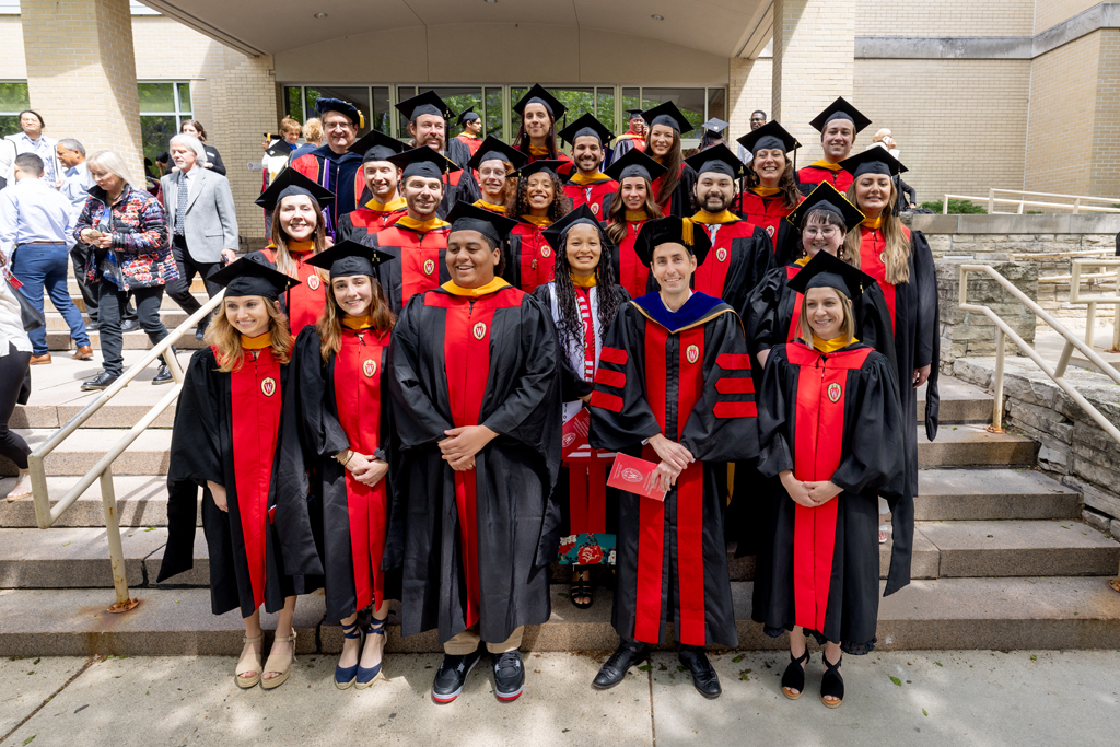 Pharmacy_Graduation_2024_119 MS in psychoactive pharmaceutical investigation graduates pose for a photo with Assistant Professor Cody Wenthur