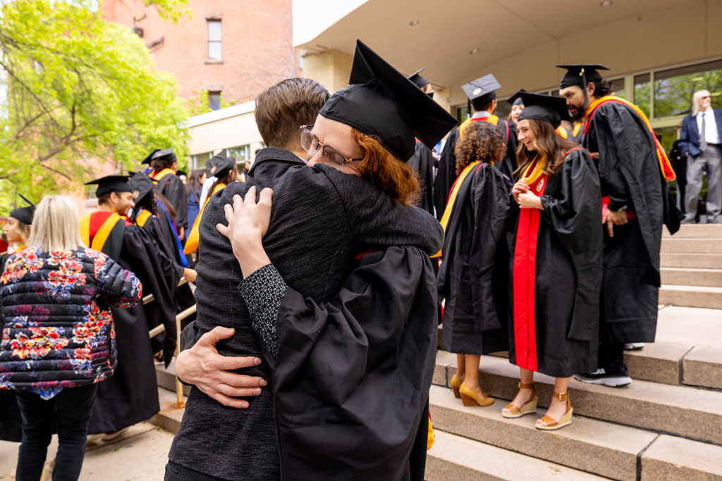 Pharmacy_Graduation_2024_122 A graduate and family embrace