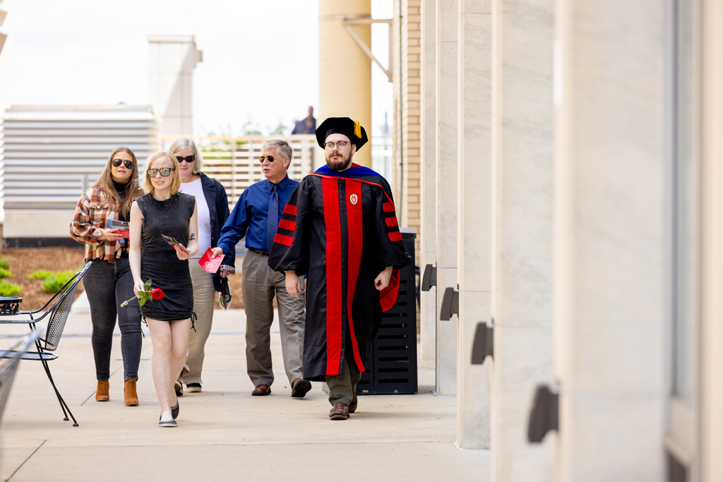 Pharmacy_Graduation_2024_136 Chris Stevens walks with family