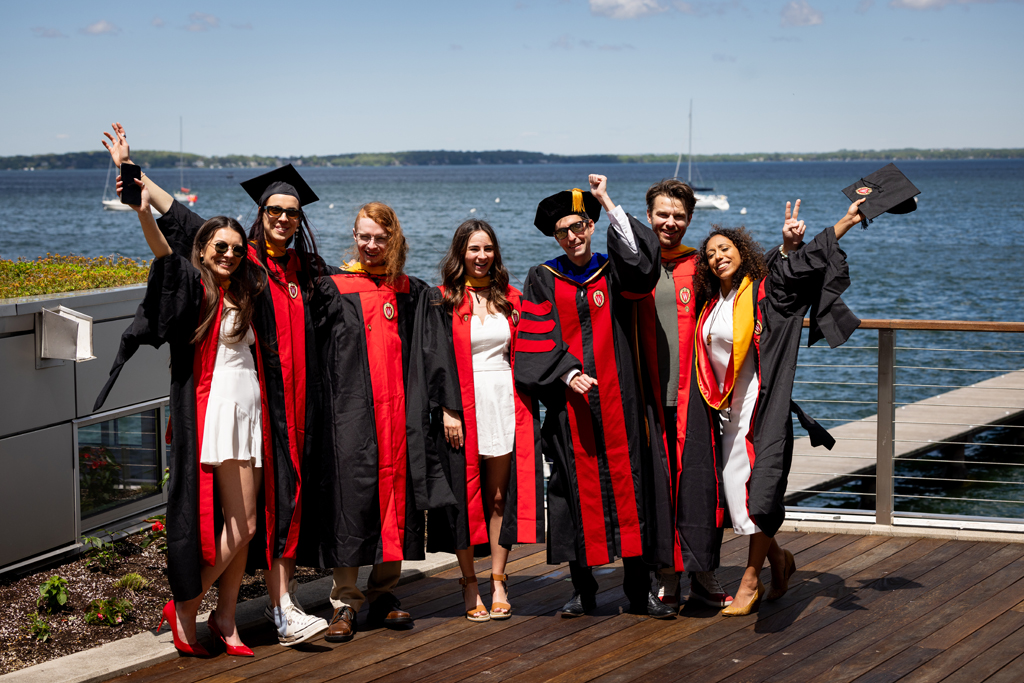 Pharmacy_Graduation_2024_219 A group of graduates smile outside