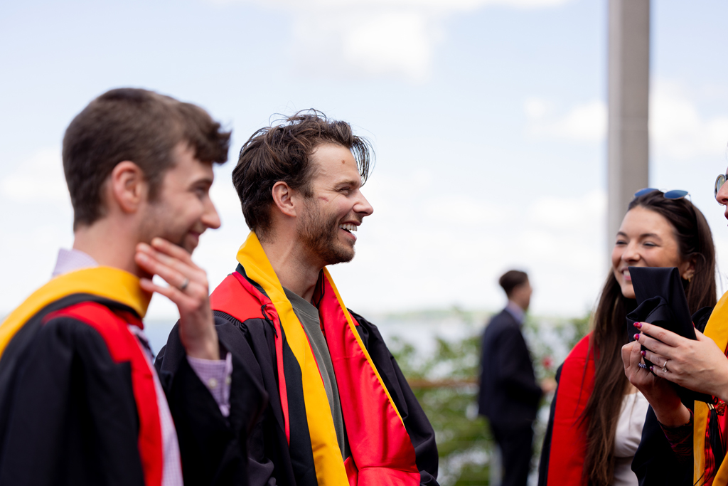 Pharmacy_Graduation_2024_227 Graduates smile outside