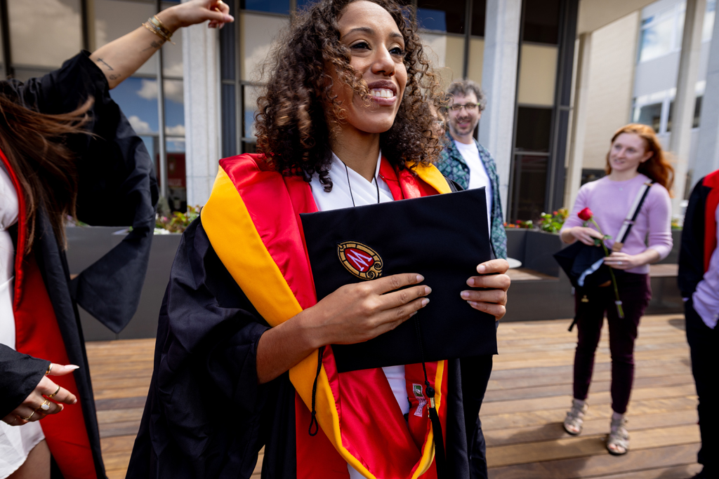 Pharmacy_Graduation_2024_229 Graduates smile outside