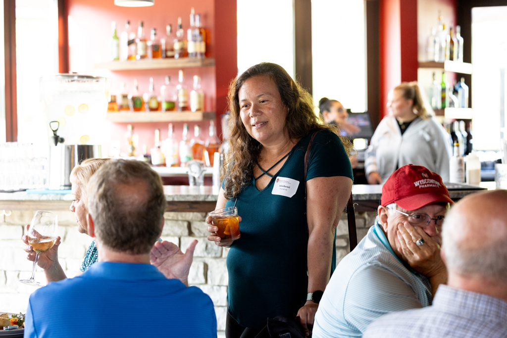 Julie Bartell speaks with other attendees
