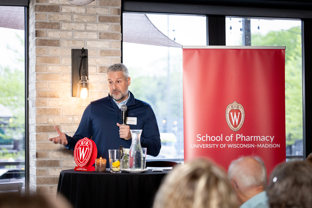 Andrew Wilcox speaks at the microphone