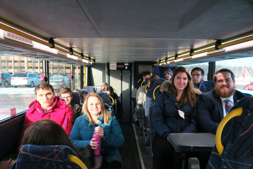 SoP Leg Day 3 Students sitting inside of Badger Coaches bus