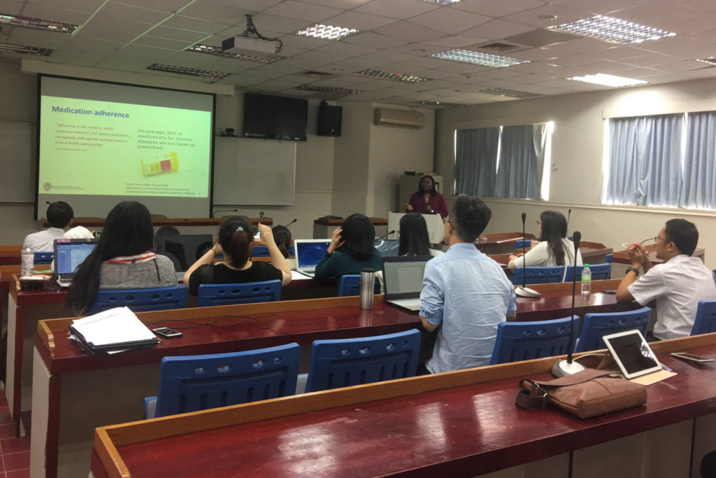 Student research presentation 1 CMU Olayinka Shiyanbola speaking to a lecture hall of students at Taipei Medical University