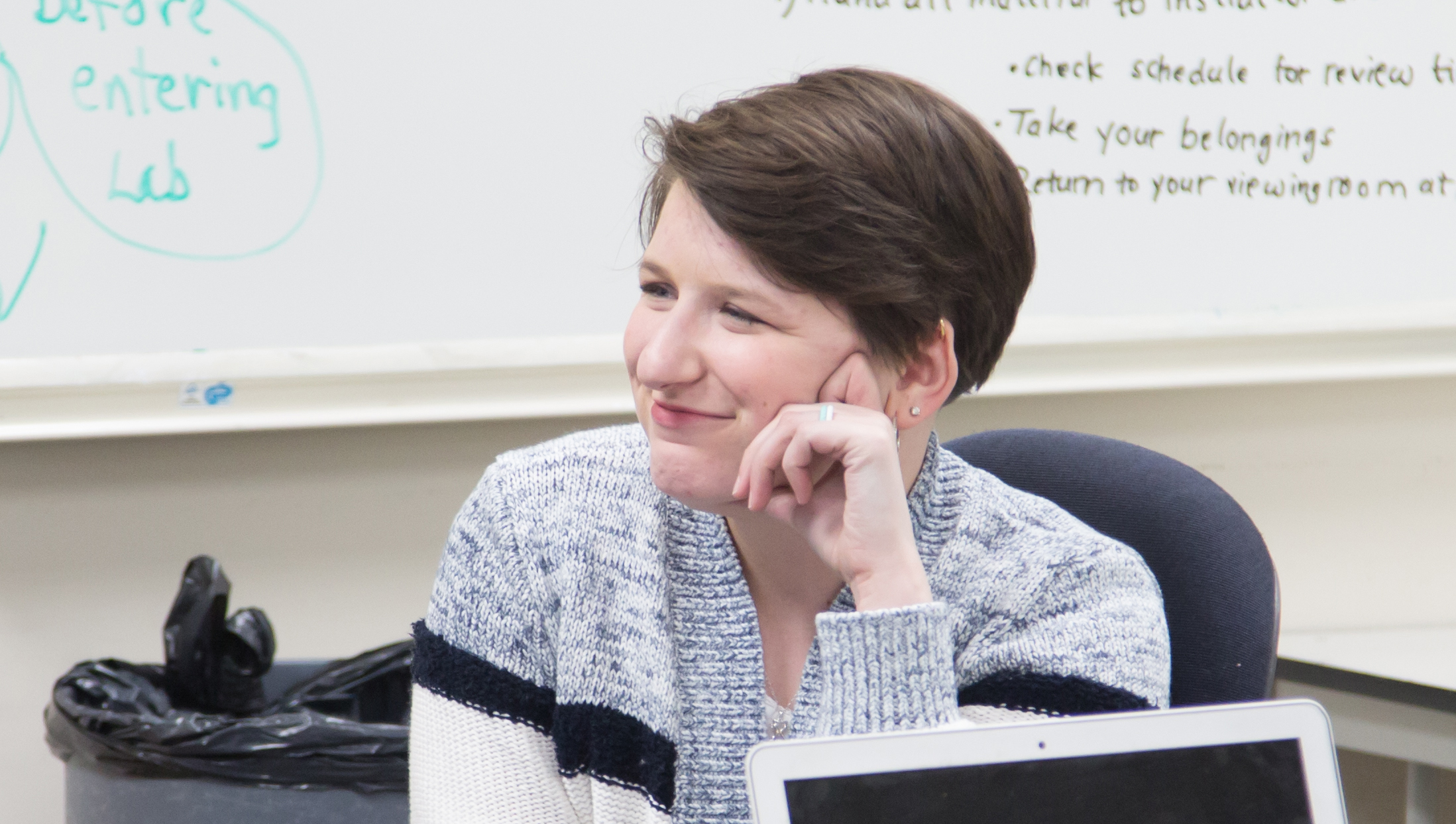 Taylor Watterson smiling in a classroom