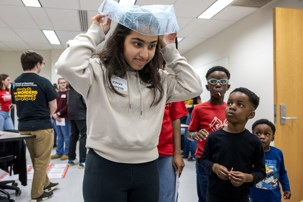 The Wonders of Pharmacy_032024_PLNZ72_7257 Kavya Kashyap tries to beat the top score as she plays The Great Garbing Race during the Wonders of Pharmacy on Saturday, March 2, 2024, at the School of Pharmacy on the campus of UW-Madison. (Photo Paul L. Newby, II)
