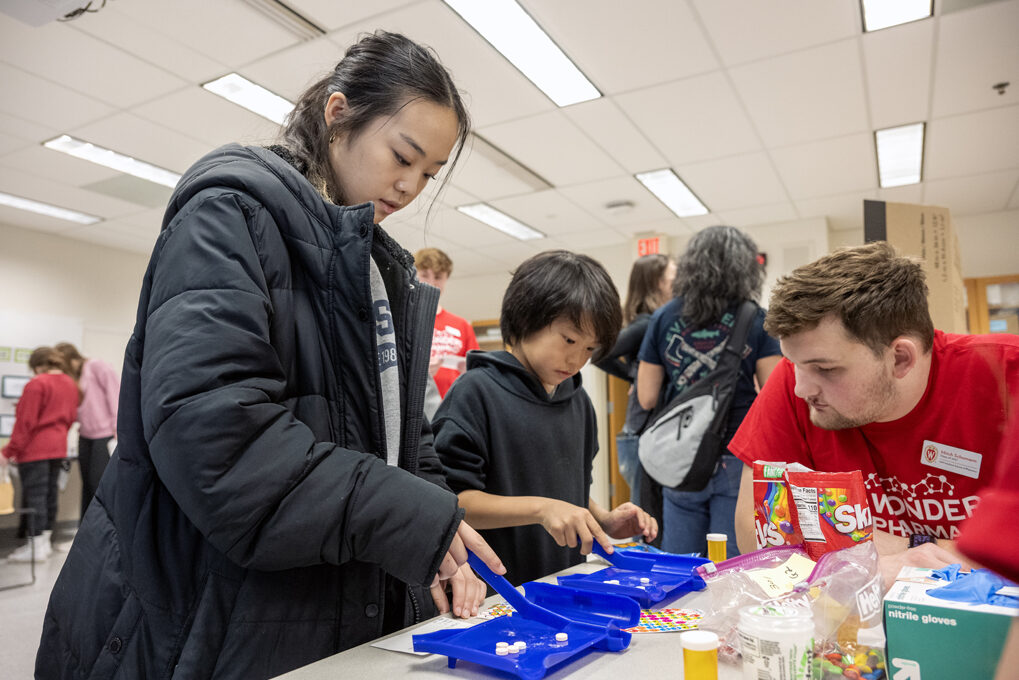 Hailey Vang and her 10-year-old brother Nolan Wang work on separating pills while trying their hands at the Sweet Rx station during the Wonders of Pharmacy on Saturday, March 2, 2024, at the School of Pharmacy on the campus of UW-Madison. (Photo Paul L. N Hailey Vang and her 10-year-old brother Nolan Wang work on separating pills while trying their hands at the Sweet Rx station during the Wonders of Pharmacy on Saturday, March 2, 2024, at the School of Pharmacy on the campus of UW-Madison. (Photo by Paul L. Newby II)