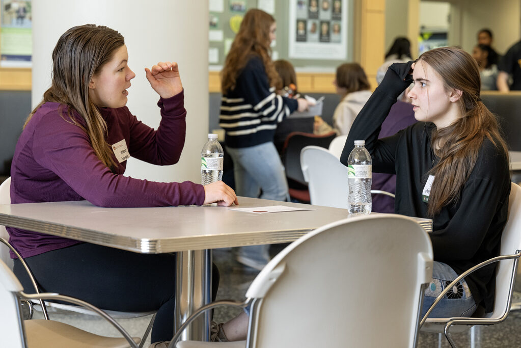 The Wonders of Pharmacy_032024_PLNZ9_5419 Alexa Vesely, left, and friend Lizzy Mesenberg chat while grabbing a little lunch before the start of the Wonders of Pharmacy on Saturday, March 2, 2024, at the School of Pharmacy on the campus of UW-Madison. (Photo Paul L. Newby, II)
