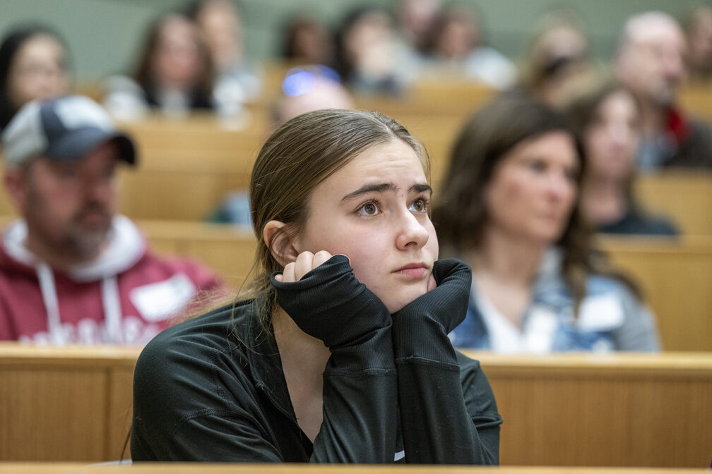 The Wonders of Pharmacy_032024_PLNZ9_5623 High schooler Lizzy Mesenberg listens as Professor Dr. Olufunmilola Abraham talks about the Wonders of Pharmacy activities on Saturday, March 2, 2024, at the School of Pharmacy on the campus of UW-Madison. (Photo Paul L. Newby, II)