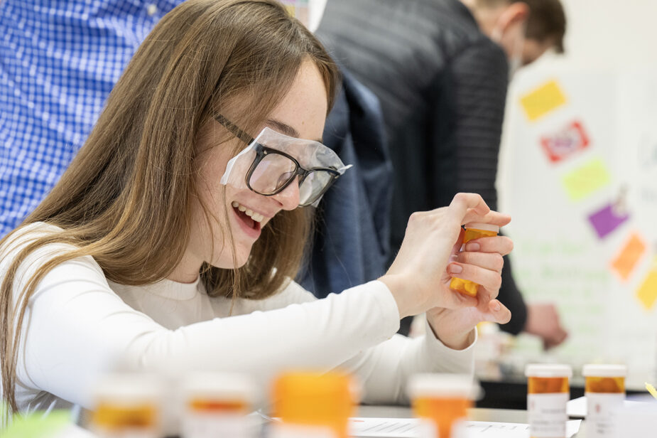 The Wonders of Pharmacy_032024_PLNZ9_5675 Ava Mueller plays the Pill Boxers game during the Wonders of Pharmacy on Saturday, March 2, 2024, at the School of Pharmacy on the campus of UW-Madison. The game shows geriatric patients' difficulties while sorting and taking their meds. (Photo Paul L. Newby, II)