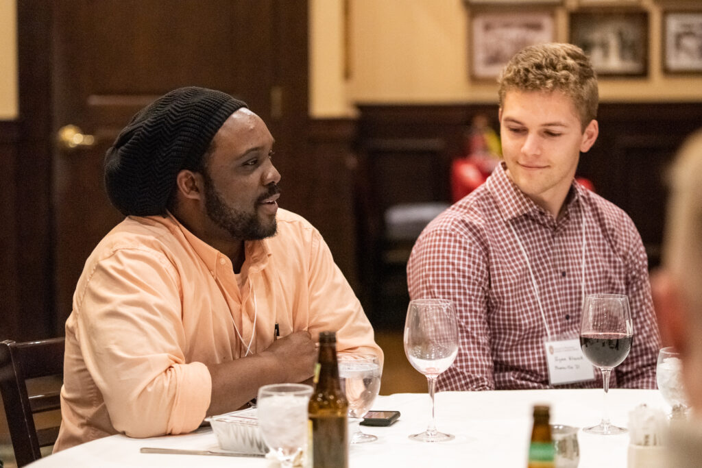 UW-Pharm-Maggianos_20220426_DSC_8652_071 Alum Kwadwo Owusu-Ofori (PhD '10) speaking with another alumni