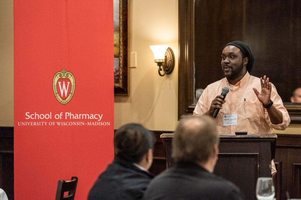 UW-Pharm-Maggianos_20220426_DSC_8698_074 Alum Kwadwo Owusu-Ofori (PhD '10) speaking at podium