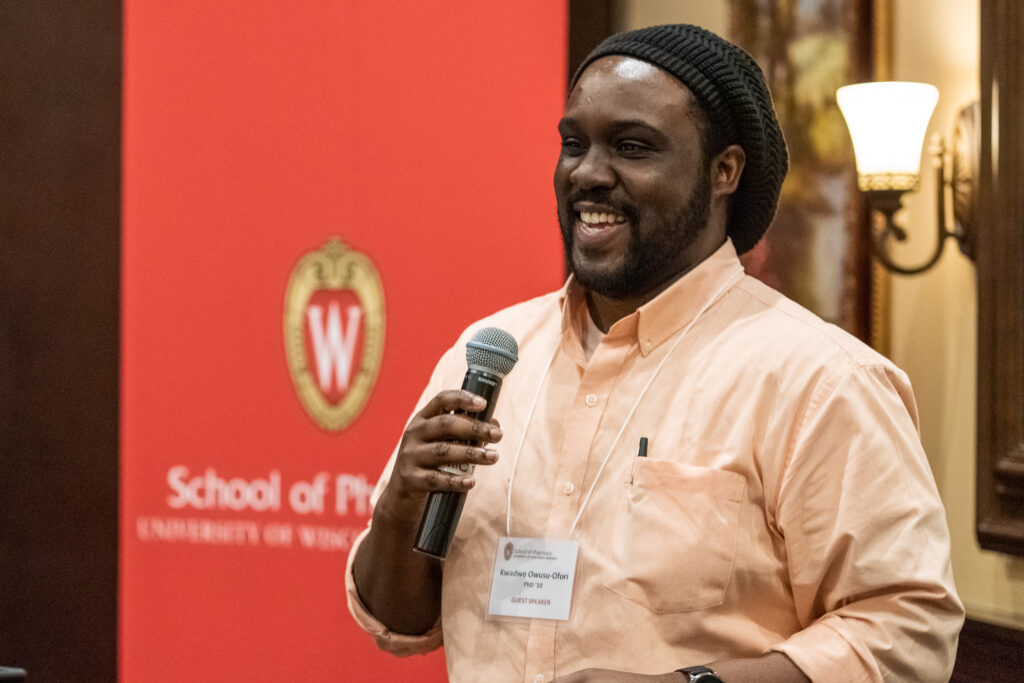 UW-Pharm-Maggianos_20220426_DSC_8744_082 Alum Kwadwo Owusu-Ofori (PhD '10) speaking at podium