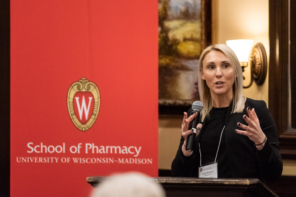 UW-Pharm-Maggianos_20220426_DSC_8830_098 Annie Biesboer (PharmD '10) speaking at the podium