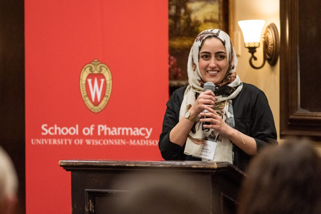 UW-Pharm-Maggianos_20220426_DSC_8879_102 Dalia Saleh speaking at the podium