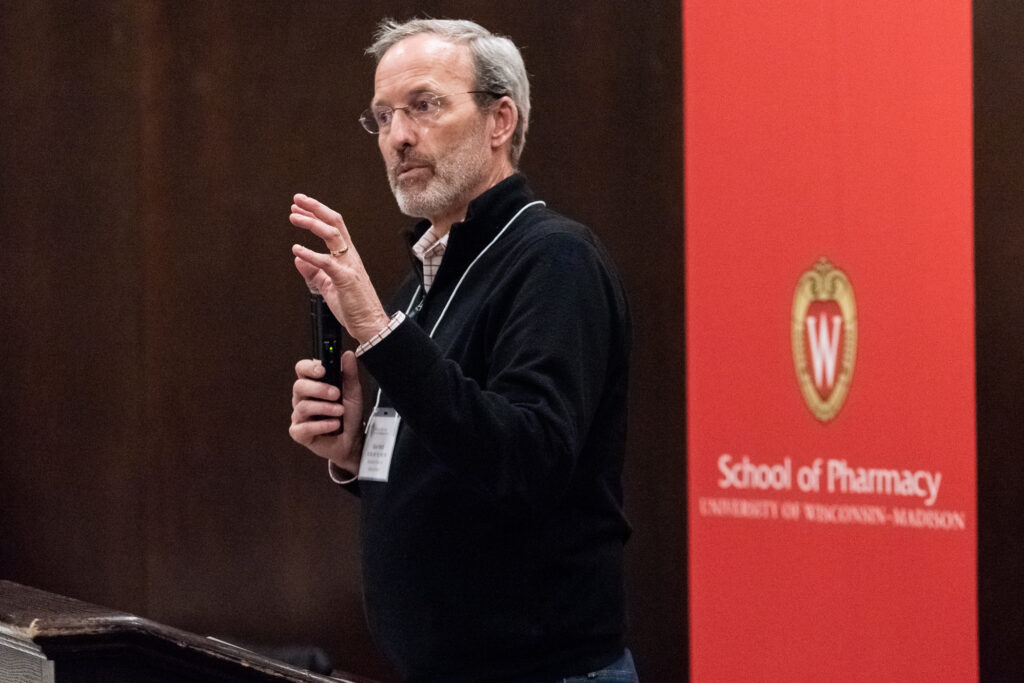 UW-Pharm-Maggianos_20220426_DSC_8984_120 Dave Mott speaking at the podium