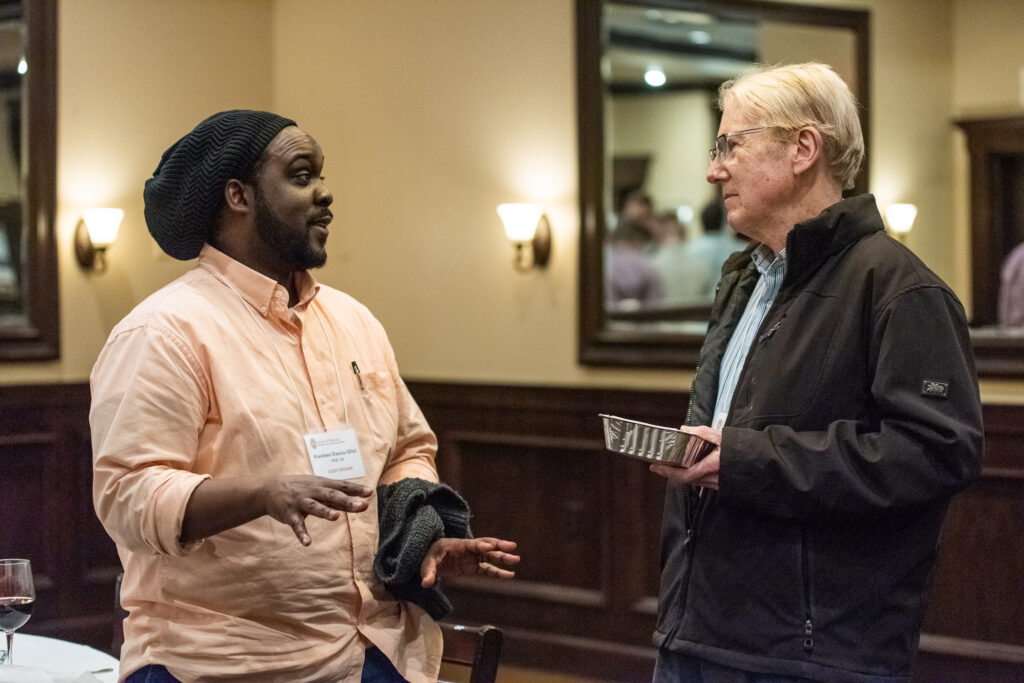 UW-Pharm-Maggianos_20220426_DSC_9022_131 Alum Kwadwo Owusu-Ofori speaking with an event attendee