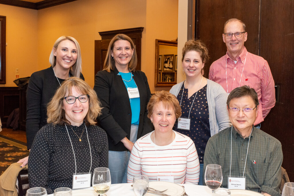 UW-Pharm-Maggianos_20220426__DSC2464_033 Alumni and hosts standing and sitting together for a group picture