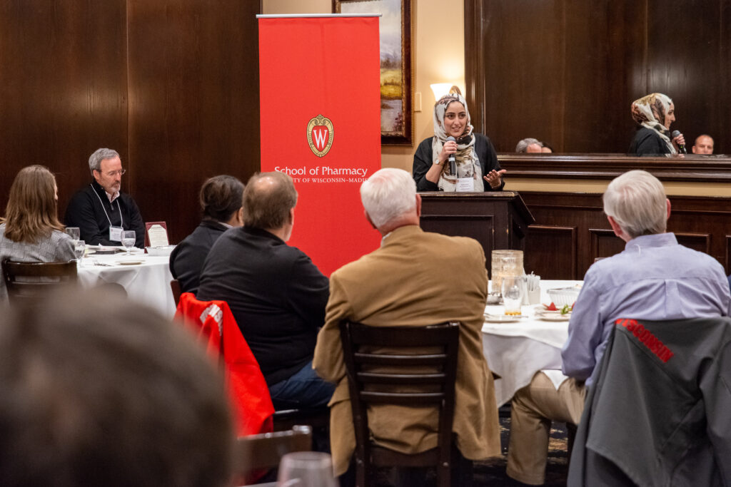 UW-Pharm-Maggianos_20220426__DSC2522_107 Dalia Saleh speaking at the podium