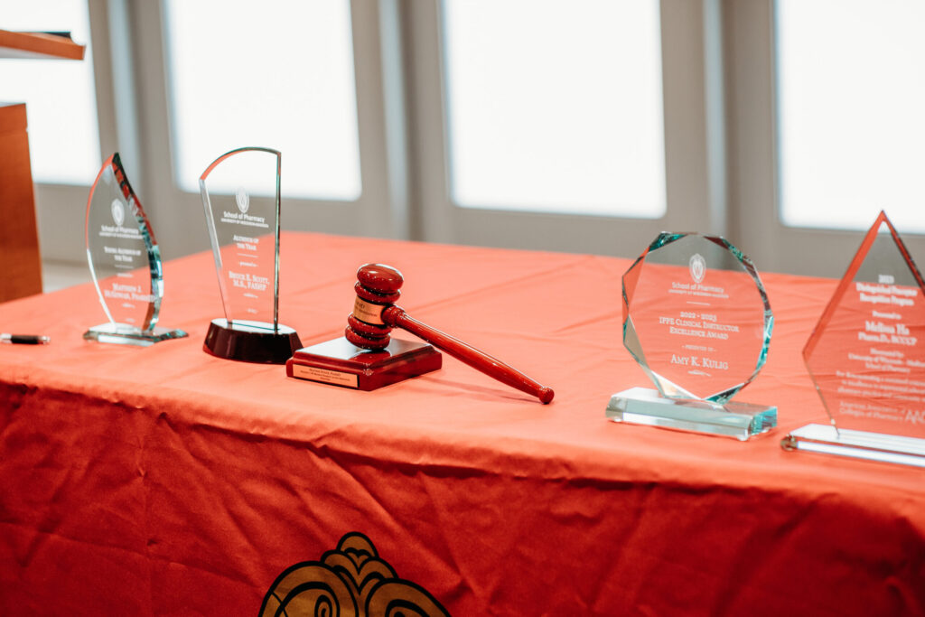 UWL-PAA-11 Four trophies and the PAA president's gavel sitting on a table.