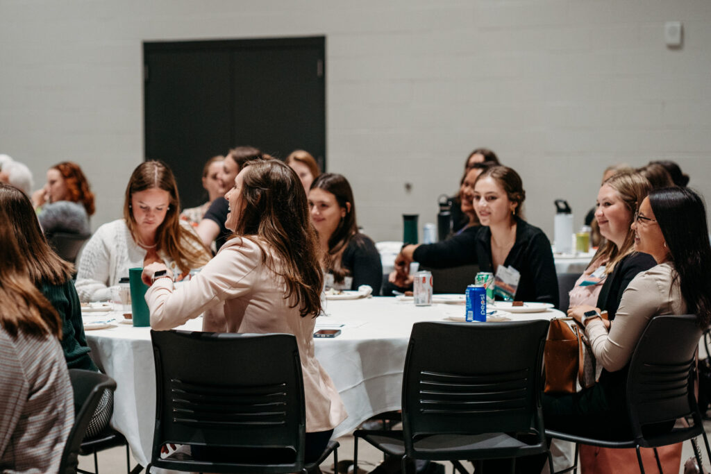 UWL-PAA-35 Students sitting at a table.