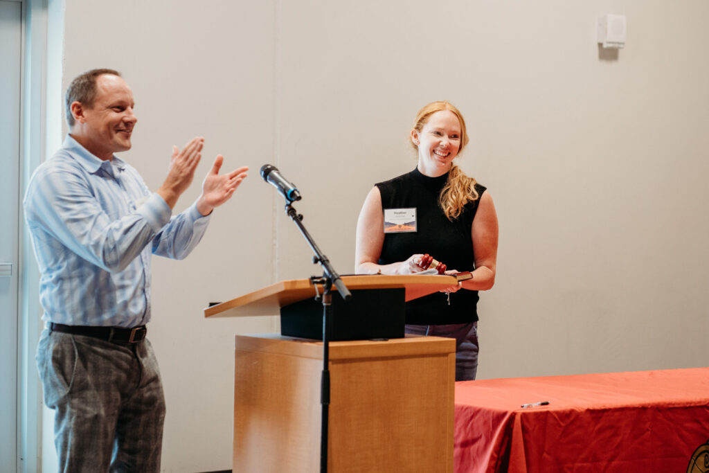 UWL-PAA-65 Jason Lau applauding new PAA president Heather Spatchek.