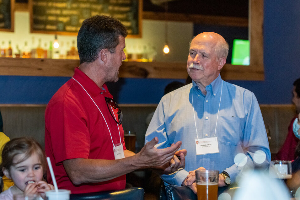 UWPharm-Coopers_2022_DSC_1444_015 Retired Professor Jim DeMuth chats with Mike Martin