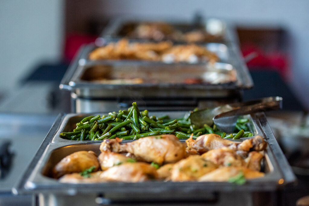 UWPharm-Coopers_2022_DSC_1539_040 Buffet of food including cut green beans and drum sticks