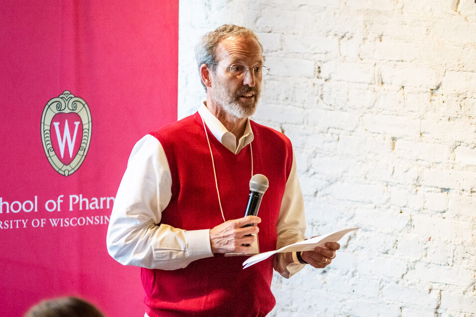 UWPharm-Coopers_2022_DSC_1612_058 Dave Mott speaking at alumni event at Cooper's Tavern