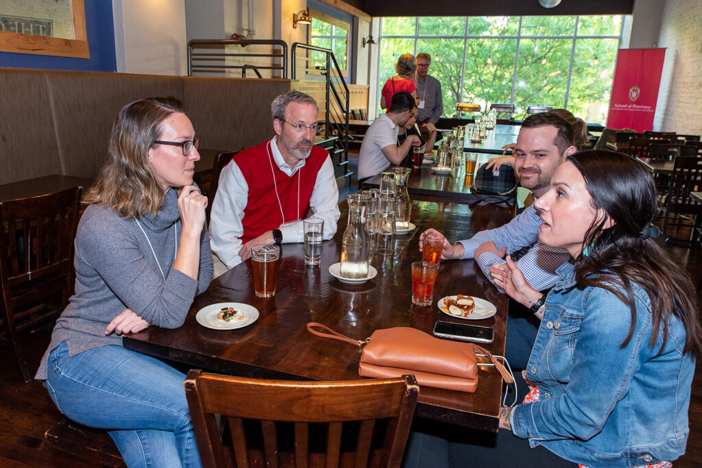 UWPharm-Coopers_2022__DSC4046_011 Dave Mott with alumni and attendees at Cooper's Tavern