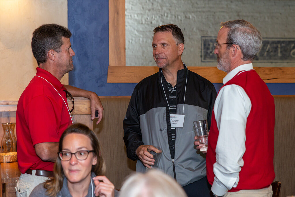 UWPharm-Coopers_2022__DSC4073_032 Dave Mott speaking with other staff and alumni at Cooper's Tavern