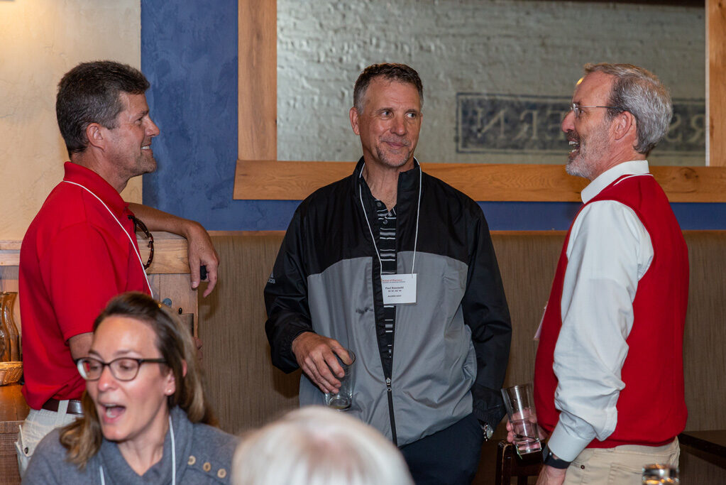 UWPharm-Coopers_2022__DSC4075_033 Dave Mott speaking with other staff and alumni at Cooper's Tavern
