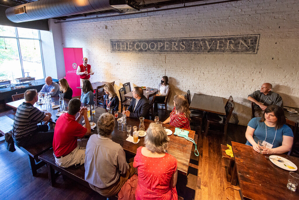 UWPharm-Coopers_2022__DSC4096_056 Dave Mott speaking to alumni attendees at Cooper's Tavern