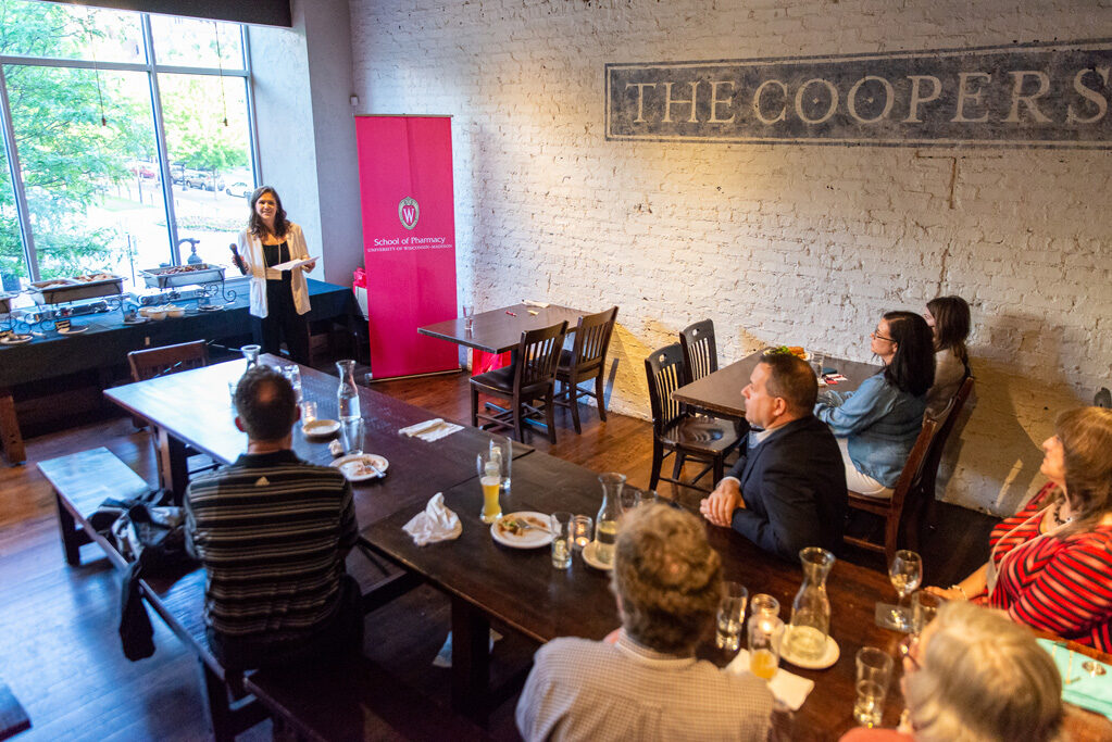 UWPharm-Coopers_2022__DSC4121_089 Pharm staff speaking to alumni attendees at Cooper's Tavern