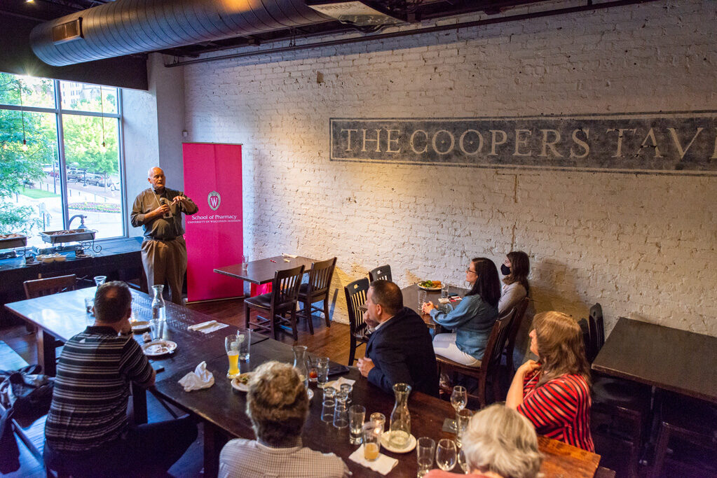 UWPharm-Coopers_2022__DSC4130_101 Paul Hutson speaks to alumni attendees at Cooper's Tavern