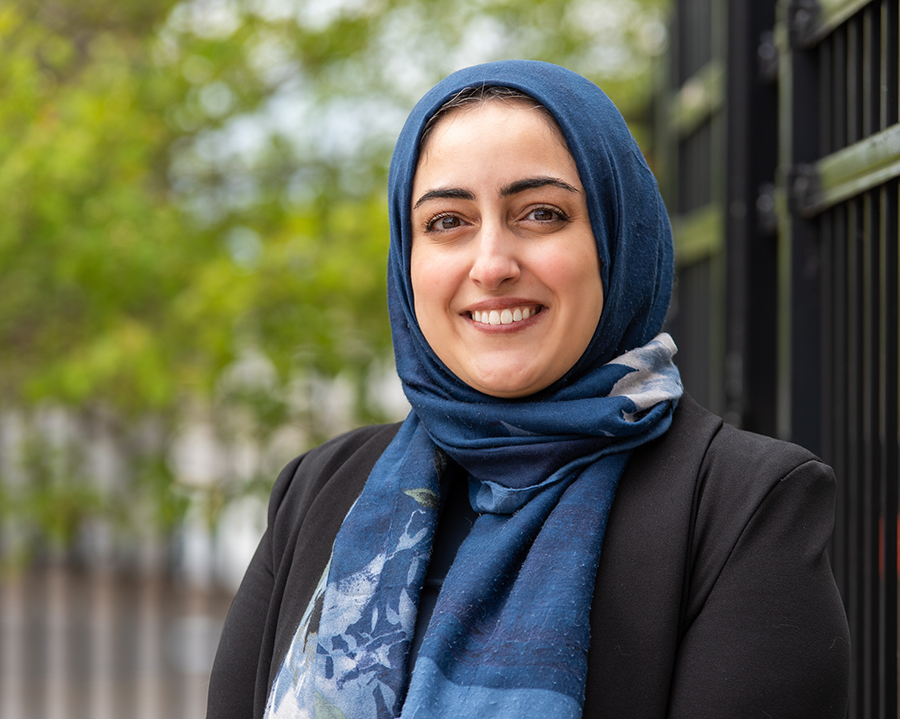 Dalia Saleh smiles outside.