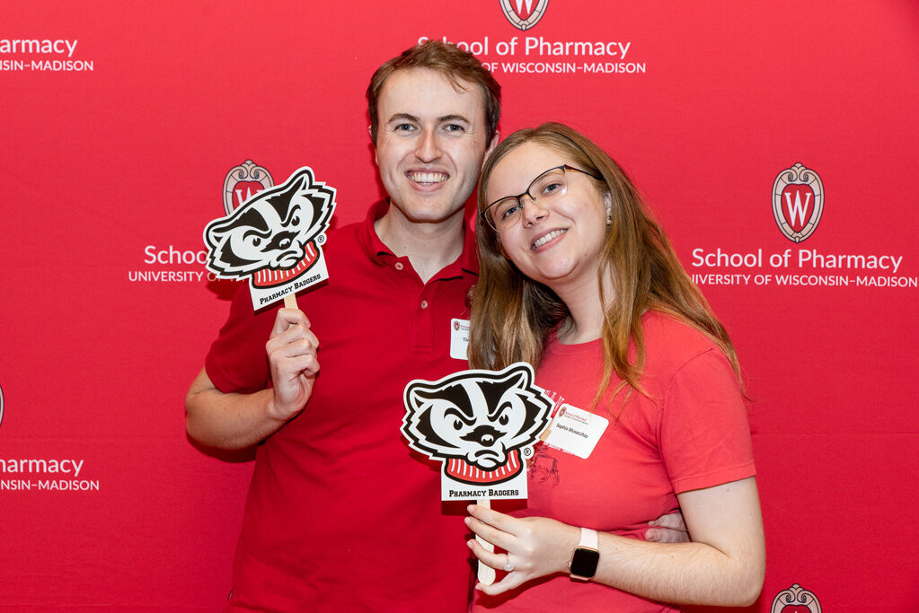UWPharm-Tailgate_09172022_028 Timothy Clark and Sophia Musacchio smile for a photo.