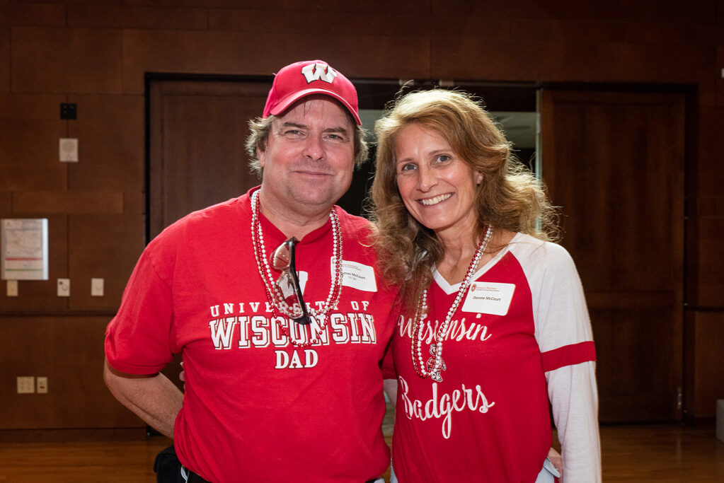 UWPharm-Tailgate_09172022_035 Dorene and Tim McCourt smile for a photo.