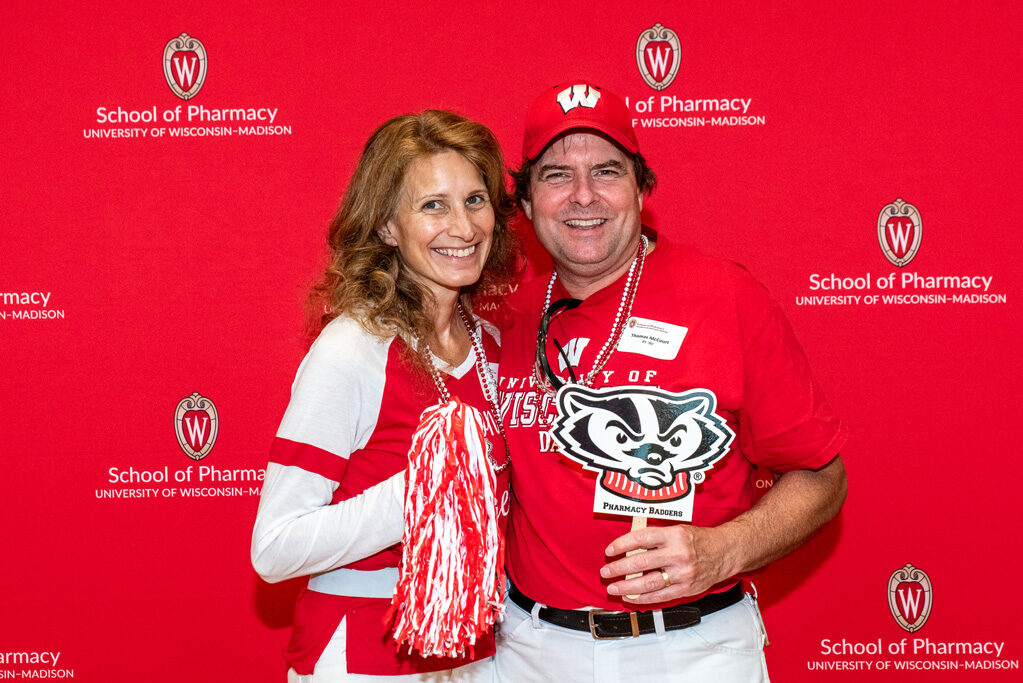 UWPharm-Tailgate_09172022_037 Dorene and Tim McCourt smile for a photo.