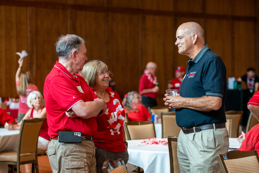 UWPharm-Tailgate_09172022_038 Russ and Sandra Jensen speak with Professor Paul Hutson.